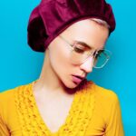 model in fashion accessory beret and glasses retro style